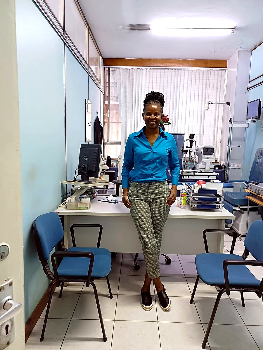 Fidelia Muma, Optometric Consultant, in the exam room at Adal Eye Clinic